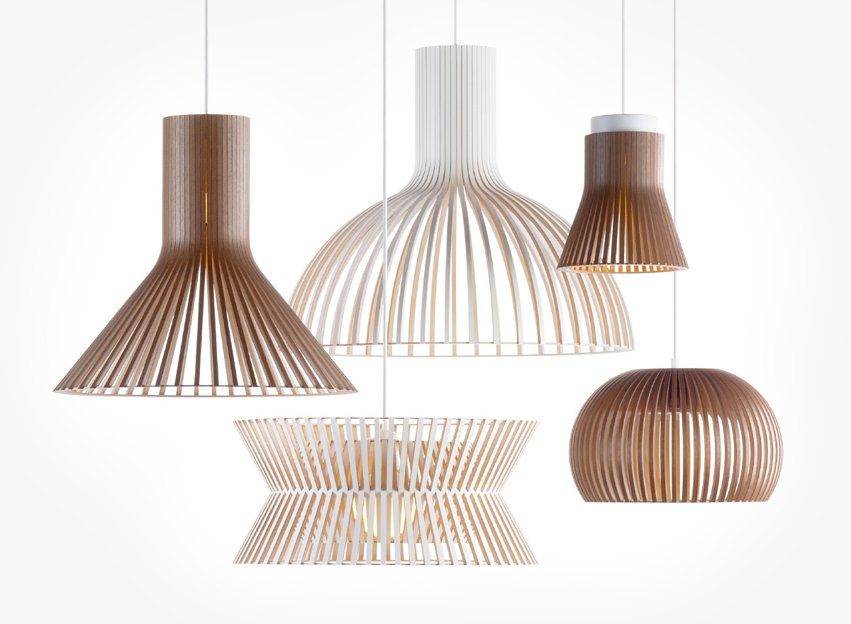 A group of wooden pendant lamps in various colors.