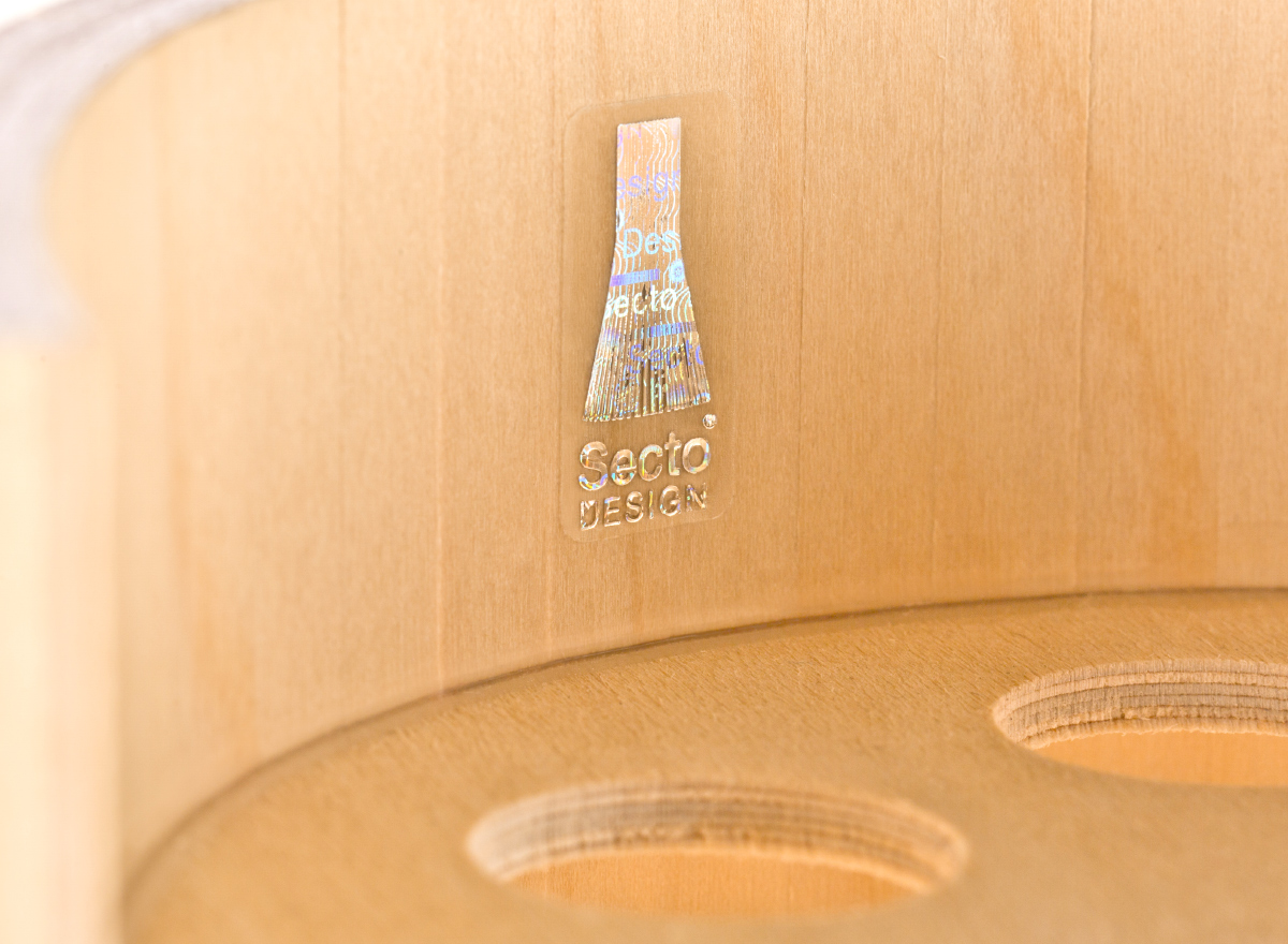 The Secto Design hologram on the inside of each wooden lampshade.