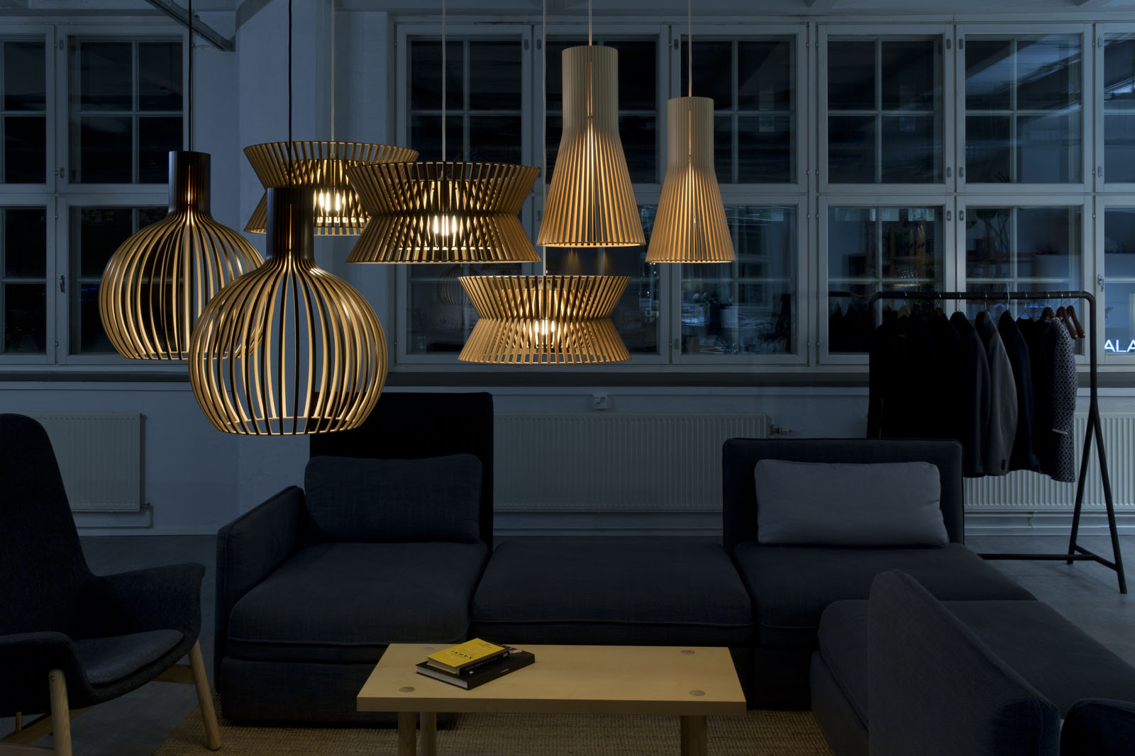 A group of pendant lamps in a lobby.