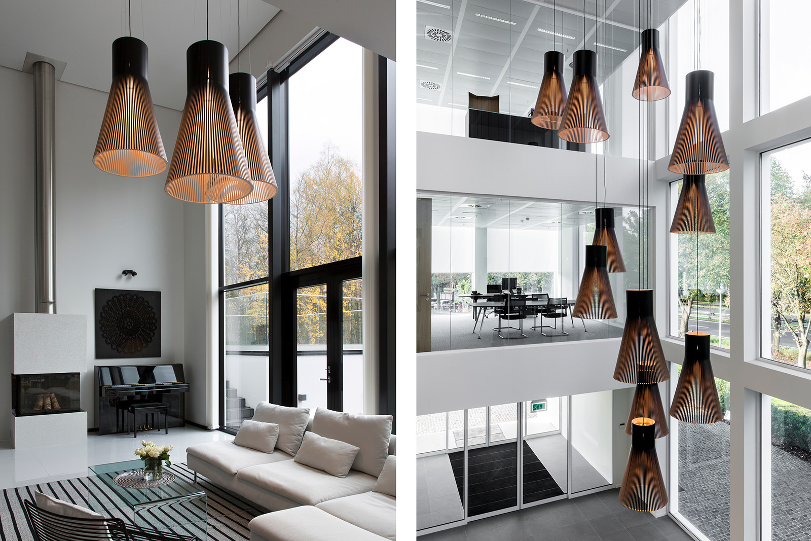 A living room with a high ceiling and a high entrance hall lit with large pendant lamps.