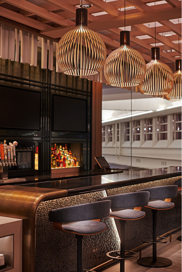 Octo Small 4241   American Airlines Admirals Club, Ronald Reagan Washington National Airport (DCA). Washington, D.C., United States. Interior design by DMAC Architecture & Interiors. Photo by Anthony Tahlier / DMAC Architecture & Interiors.